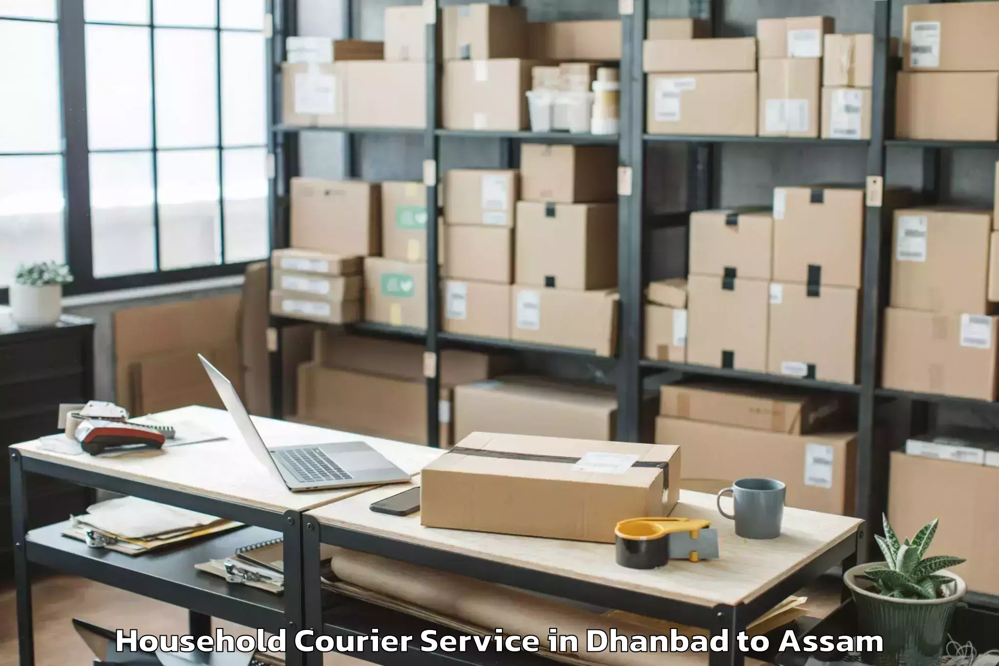 Top Dhanbad to Chaparmukh Household Courier Available